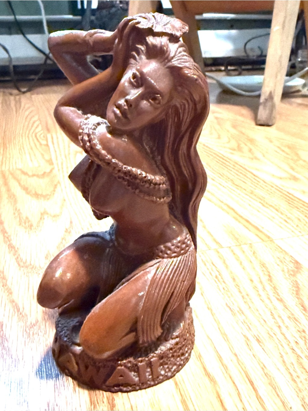 A vintage Coco Joe's Hawaiian hula girl made from”hapa wood,”composite material